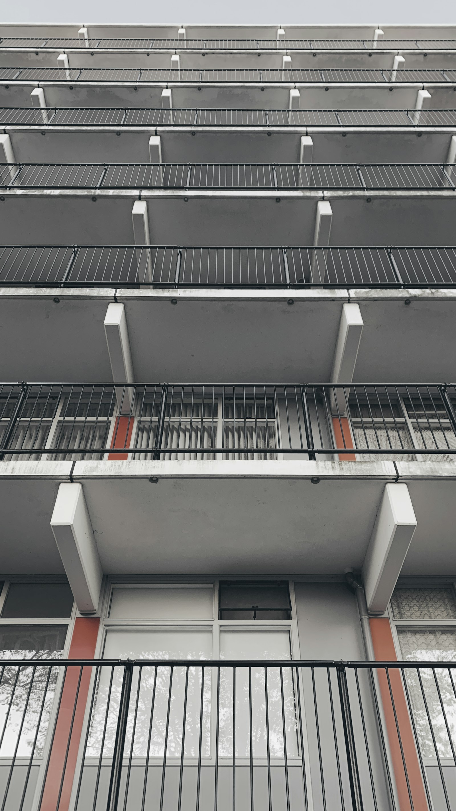 Tall building with balconies representing A Khata plots in Bangalore benefits, legality and buying tips