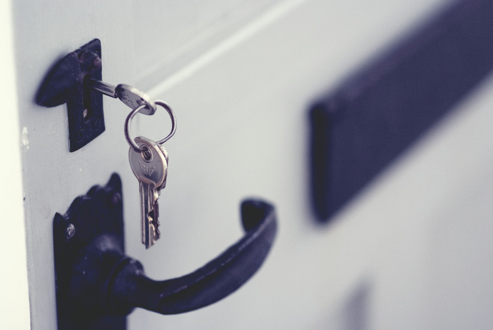 Padlock on a door representing agricultural land conversion process and fees in Karnataka