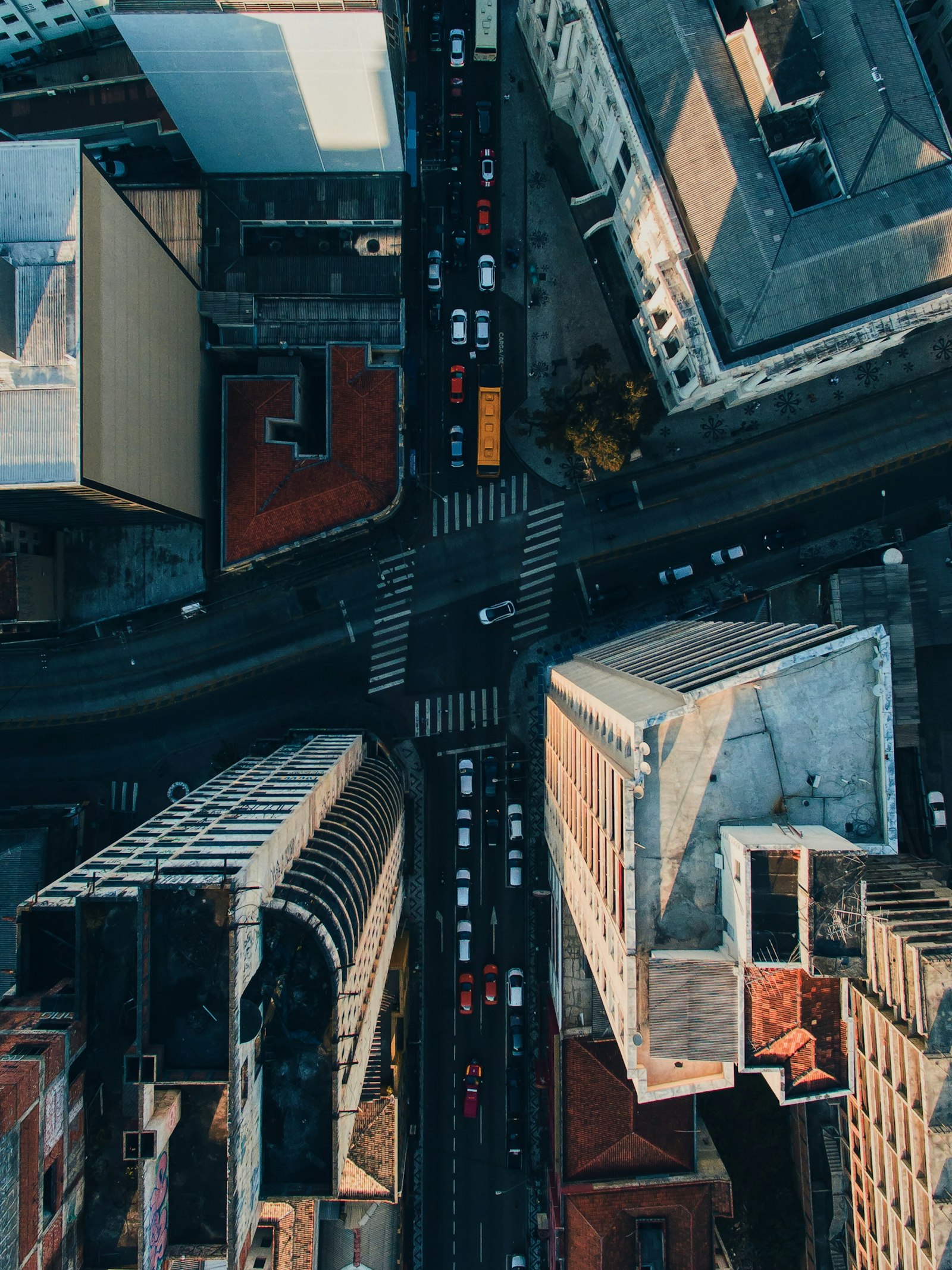 Aerial view of a road intersection surrounded by high rise buildings representing best localities to buy plots in Bangalore