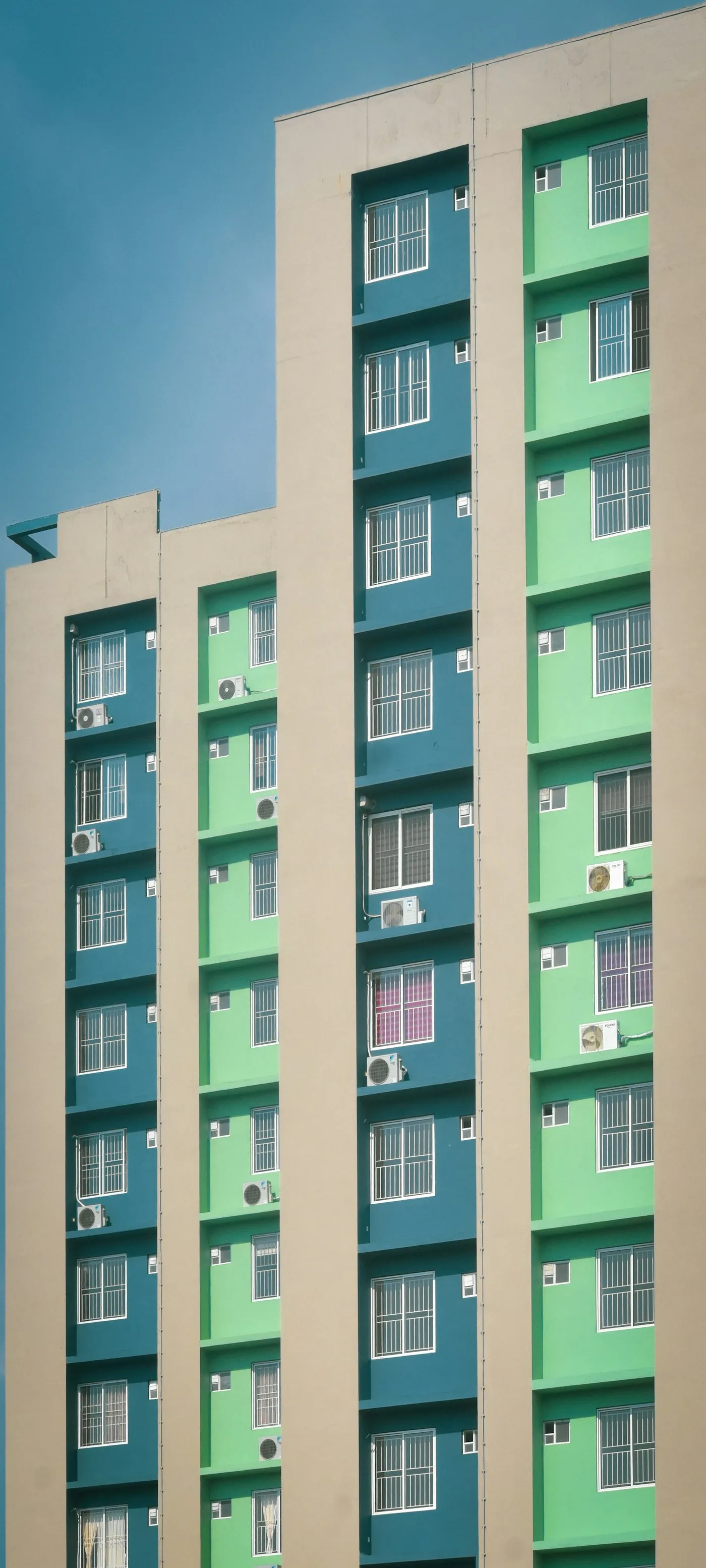 Tall multi-storey building with balconies