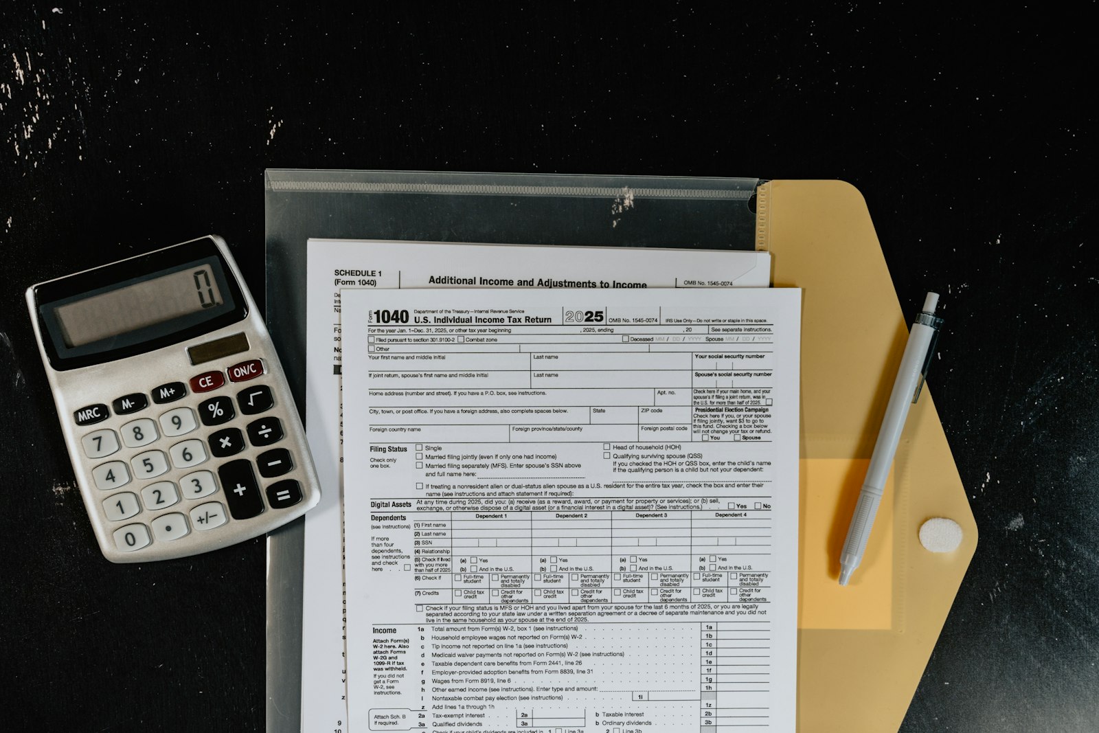 Calculator and tax forms representing TDS calculation for NRI property sales