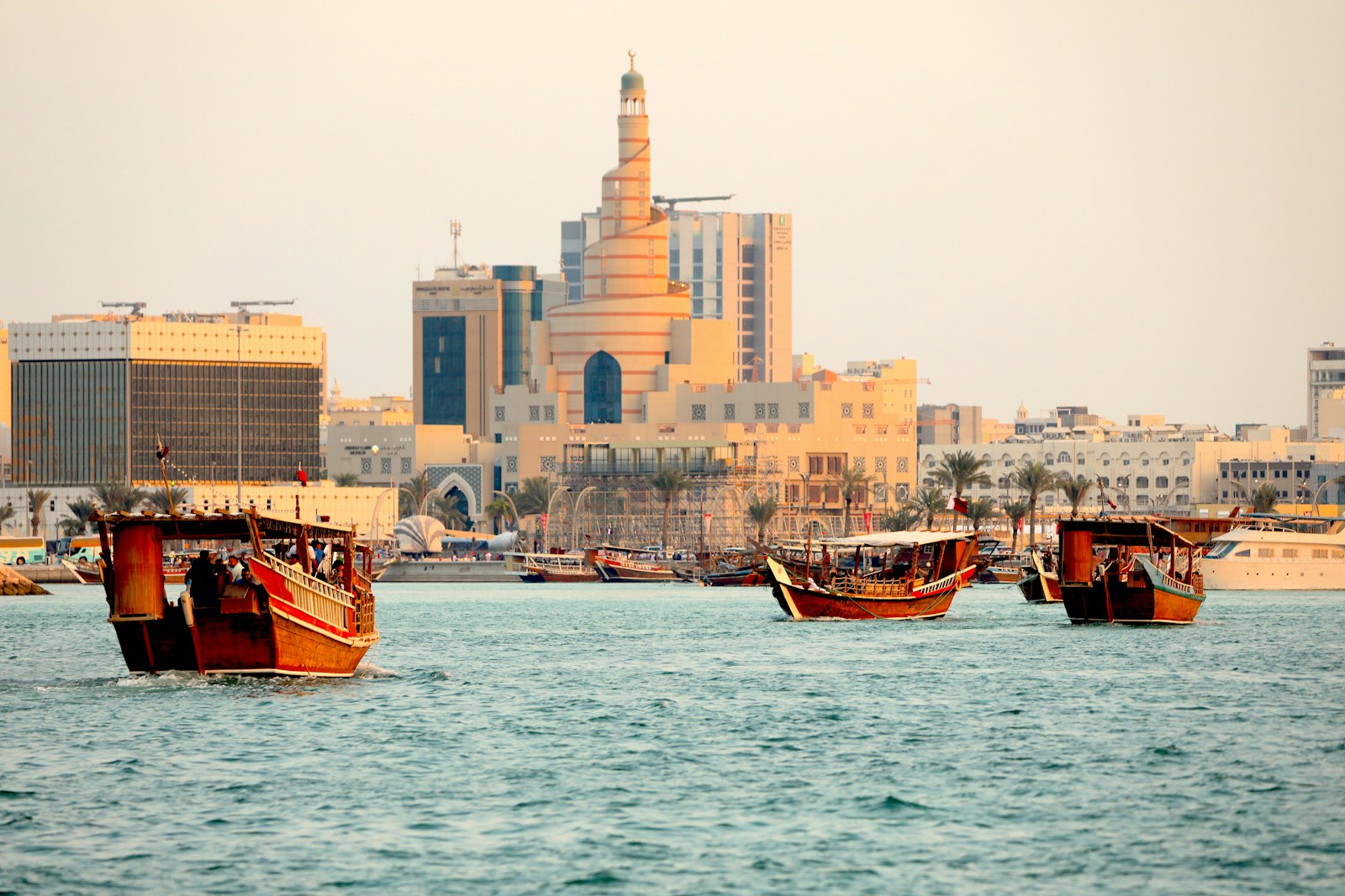 Doha skyline with traditional dhow boats, Qatar