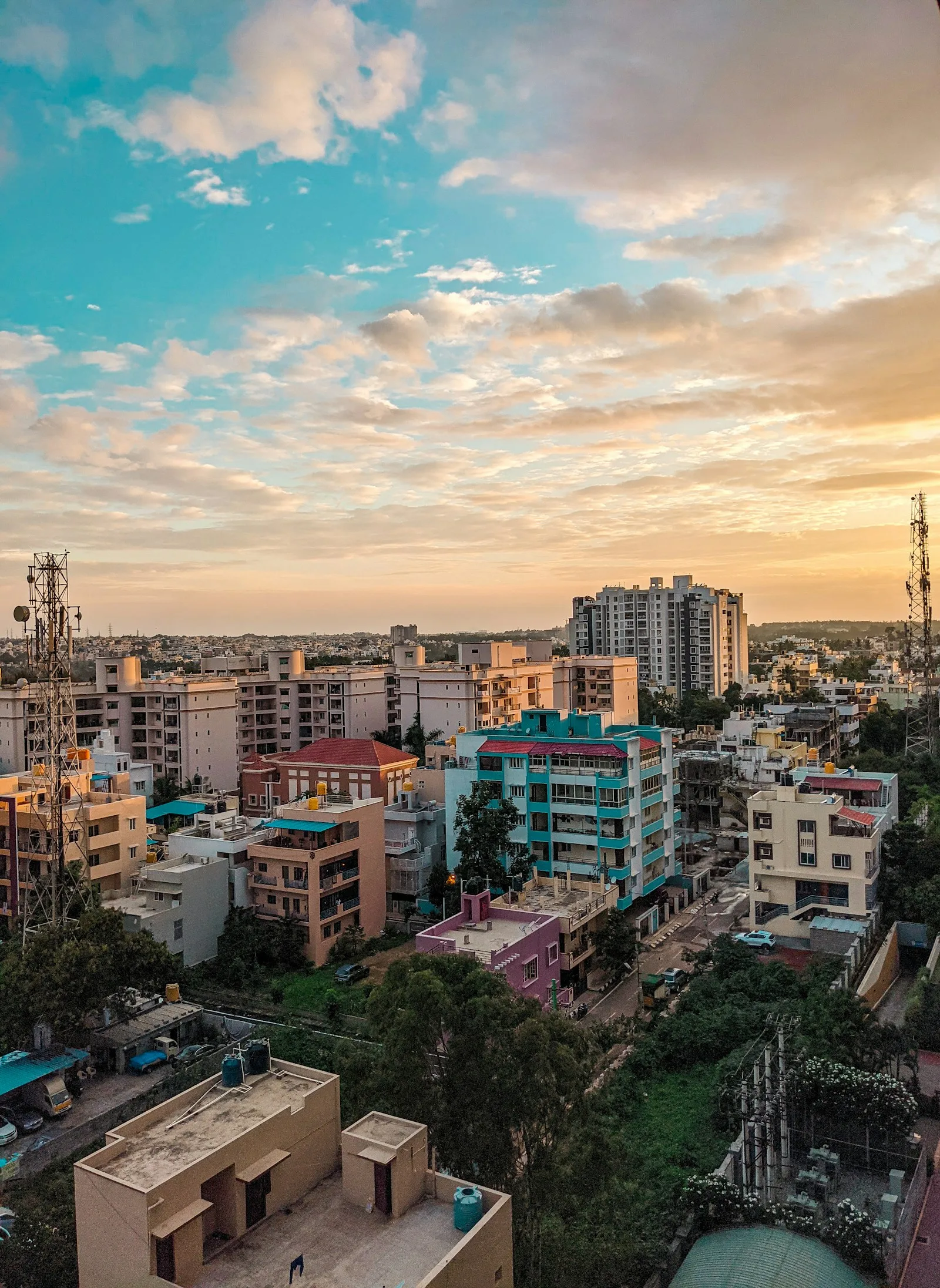High-rise buildings under a blue sky in Bengaluru