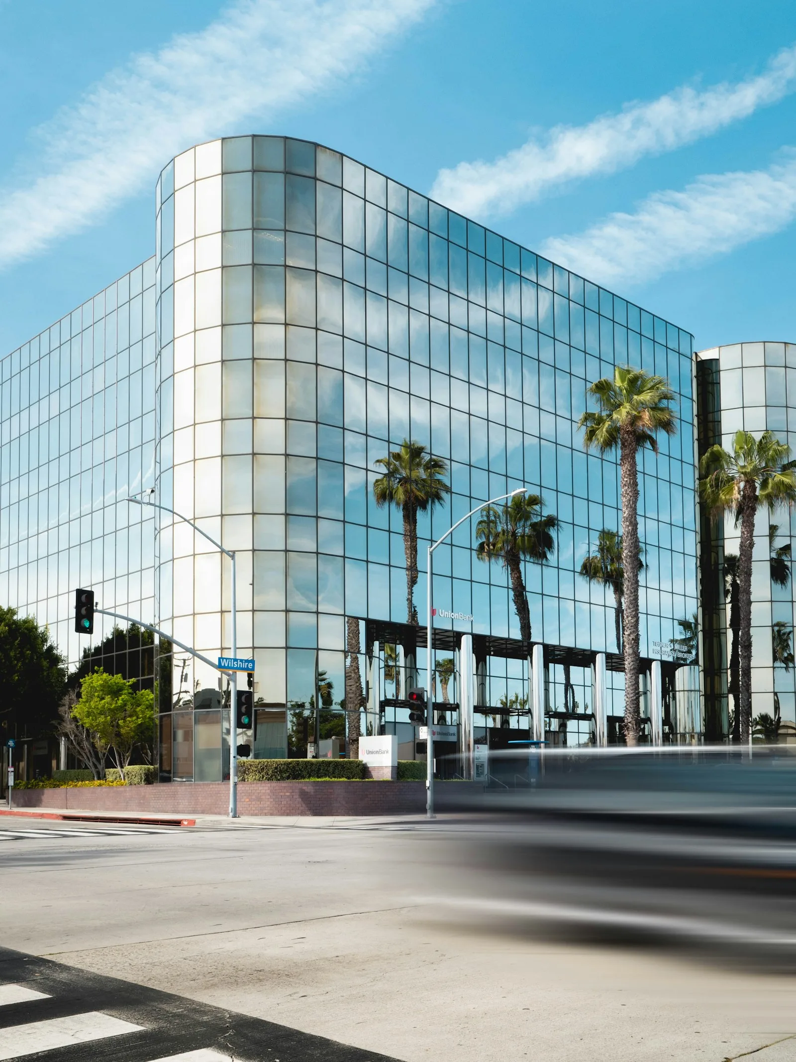 Glass-fronted office building used to illustrate the technology campuses around Electronic City