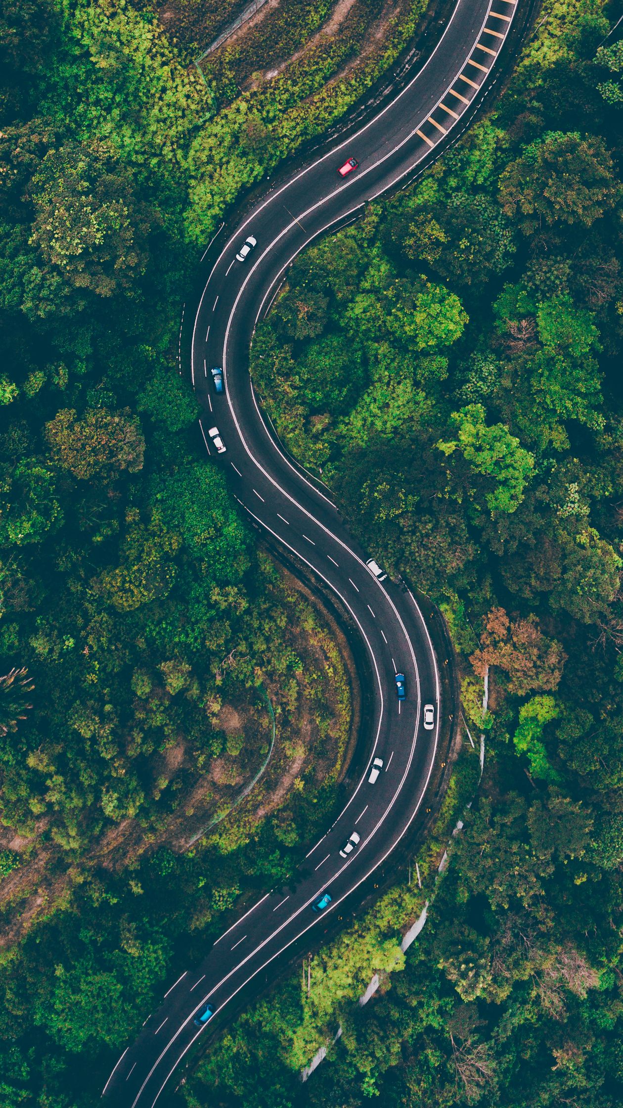 A quiet two-lane road through open countryside