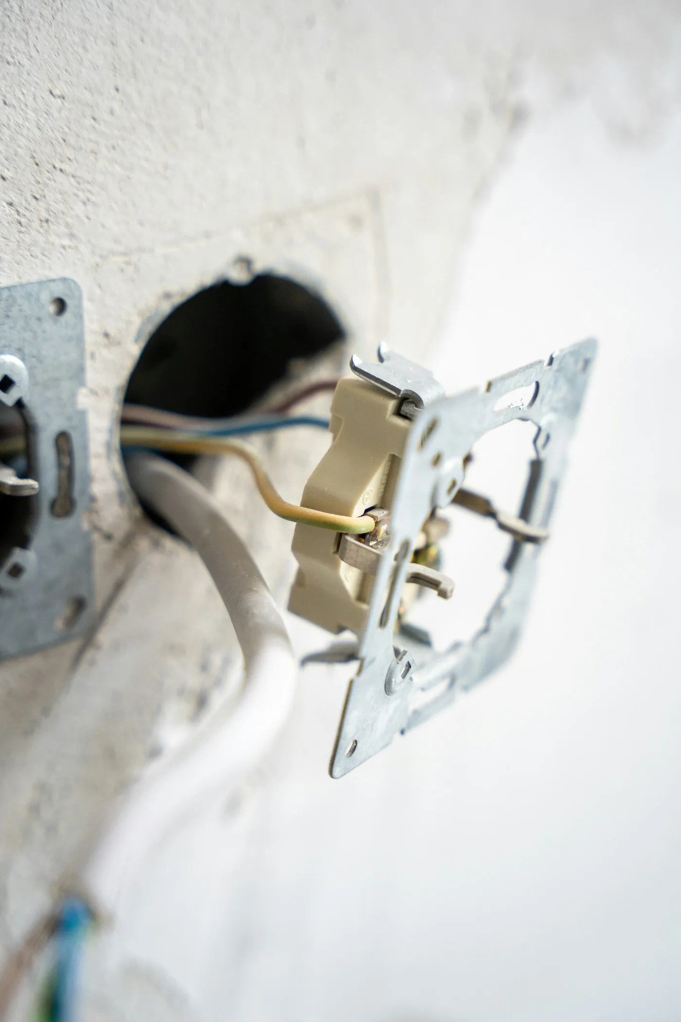 Exposed electrical wiring inside a wall