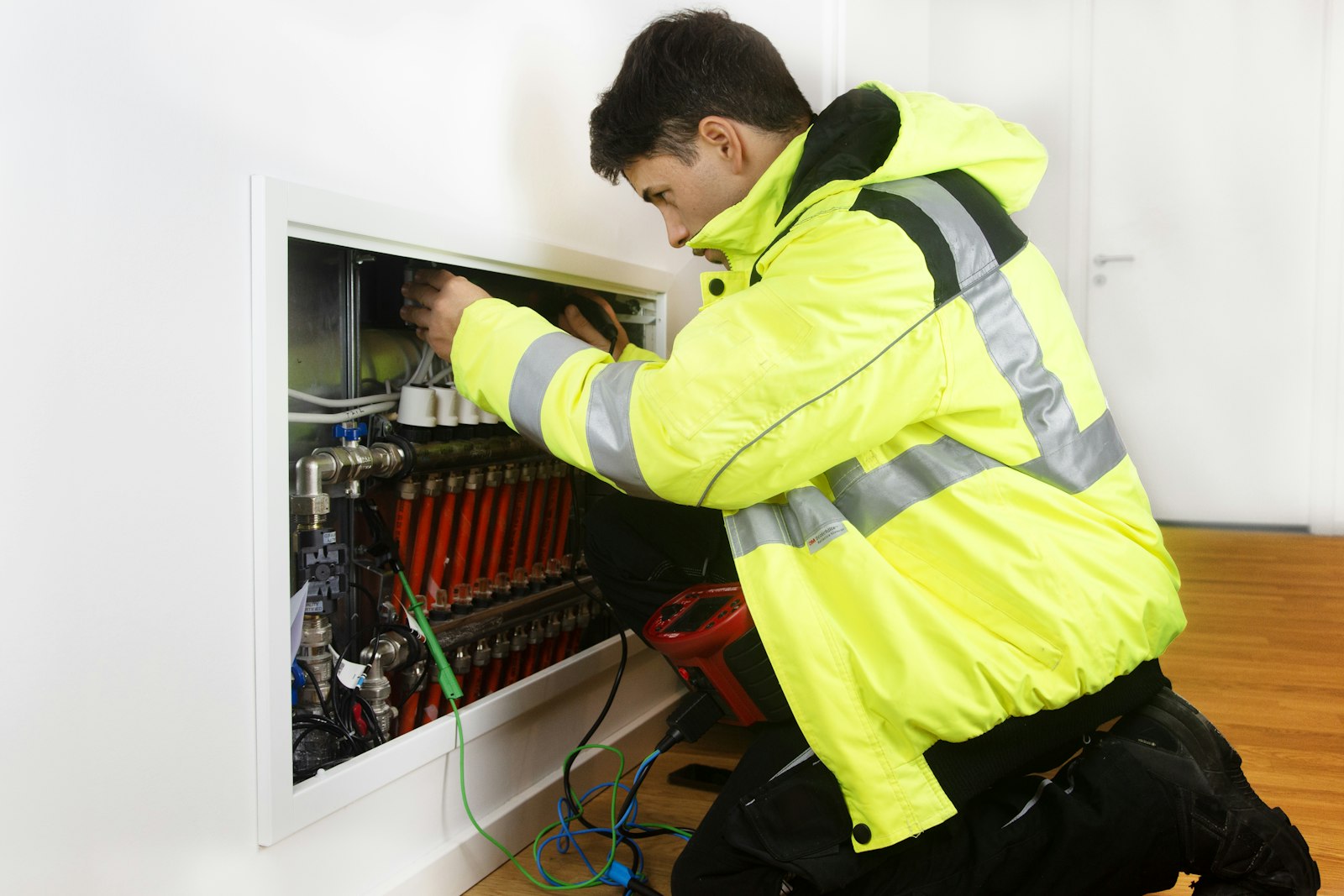 HVAC technician servicing an air conditioning system for habitability compliance