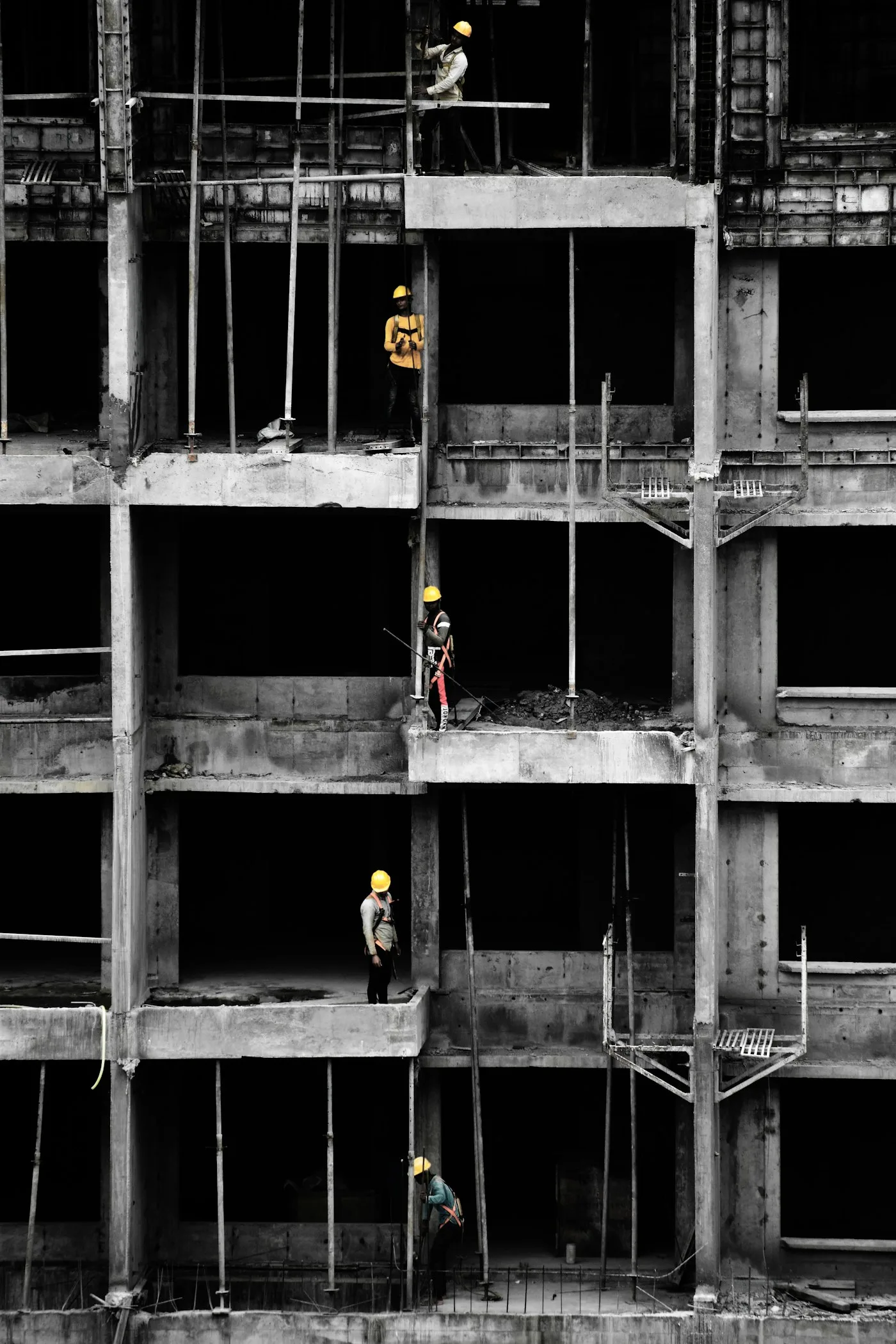 Group of men standing on a building under construction