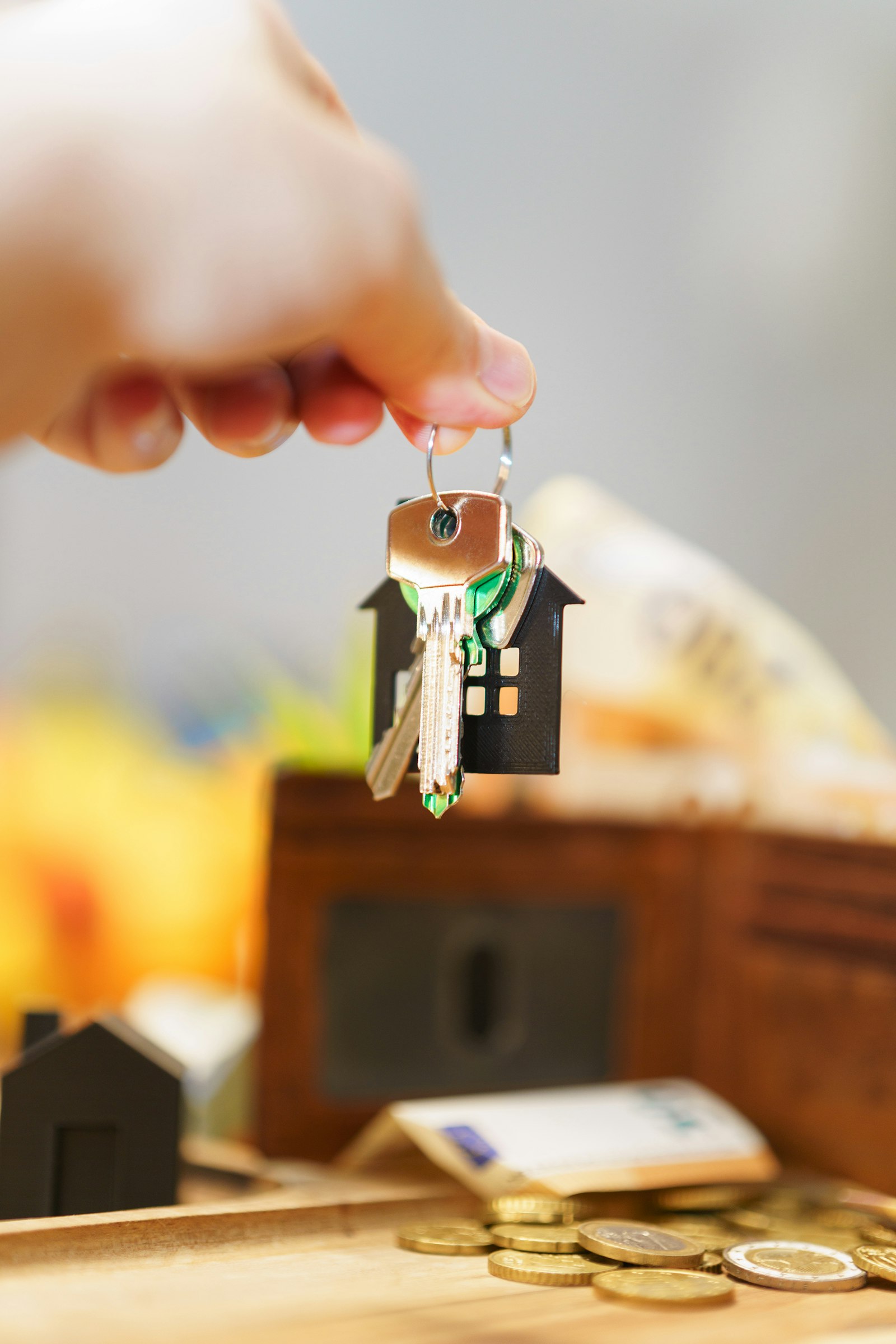 House keys with money representing property tax calculations in Karnataka