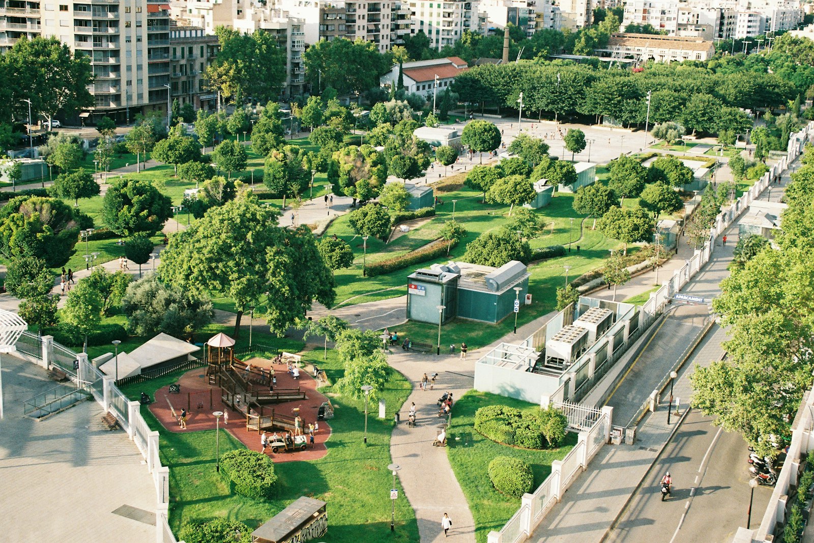 Aerial view of civic plaza with green space and buildings