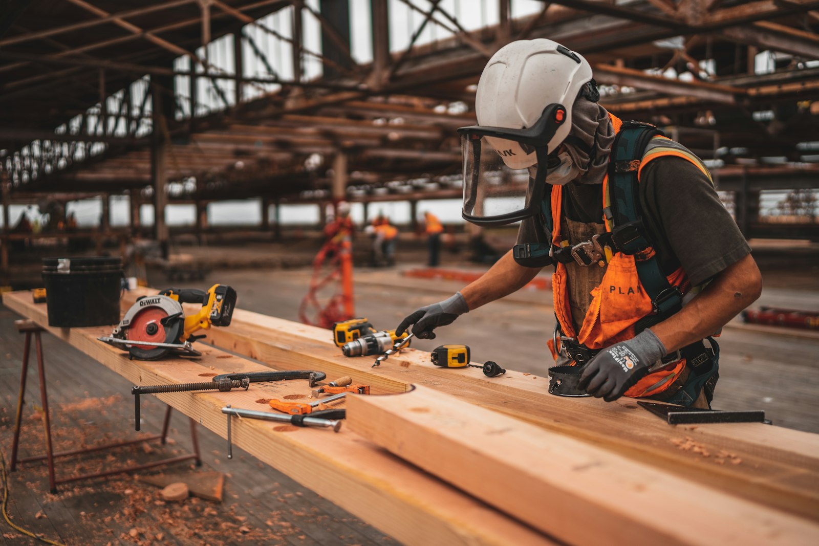 Construction worker with a power tool representing the Marathahalli real estate market