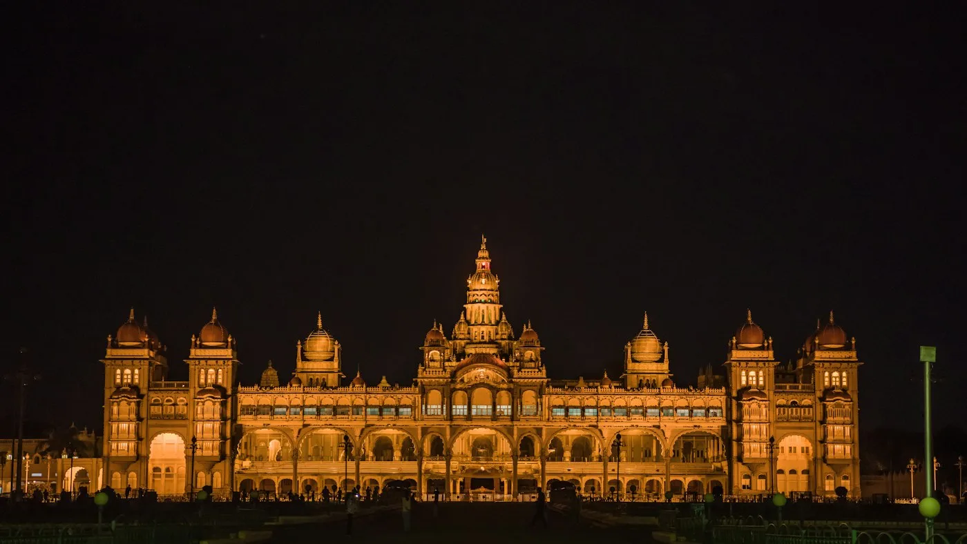 Mysore Palace lit with warm lights at night
