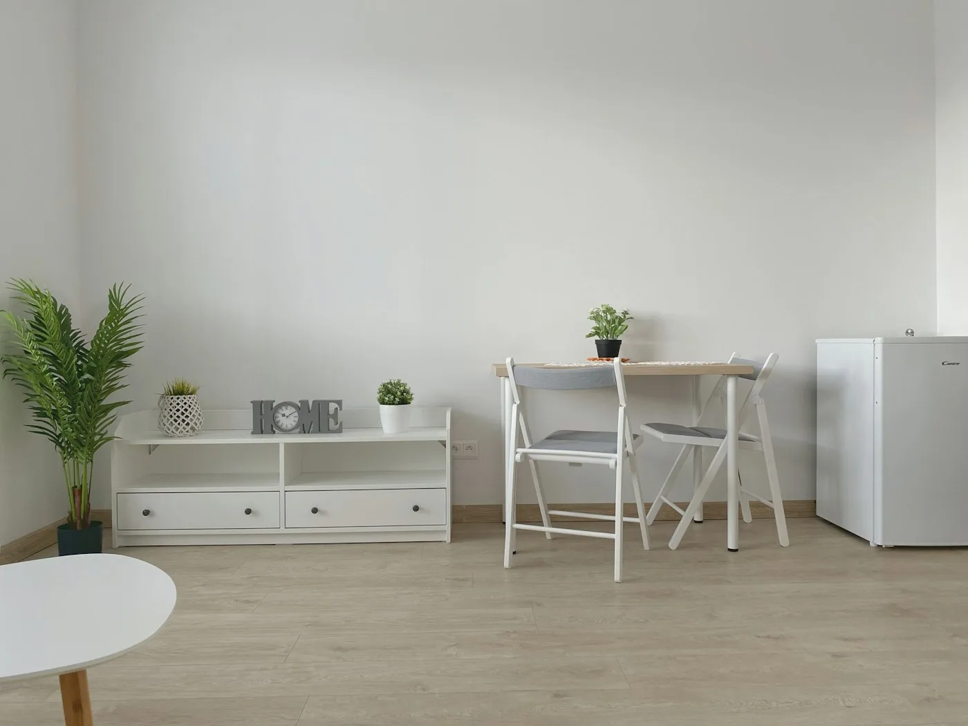 Kitchen with a table, chairs and a refrigerator