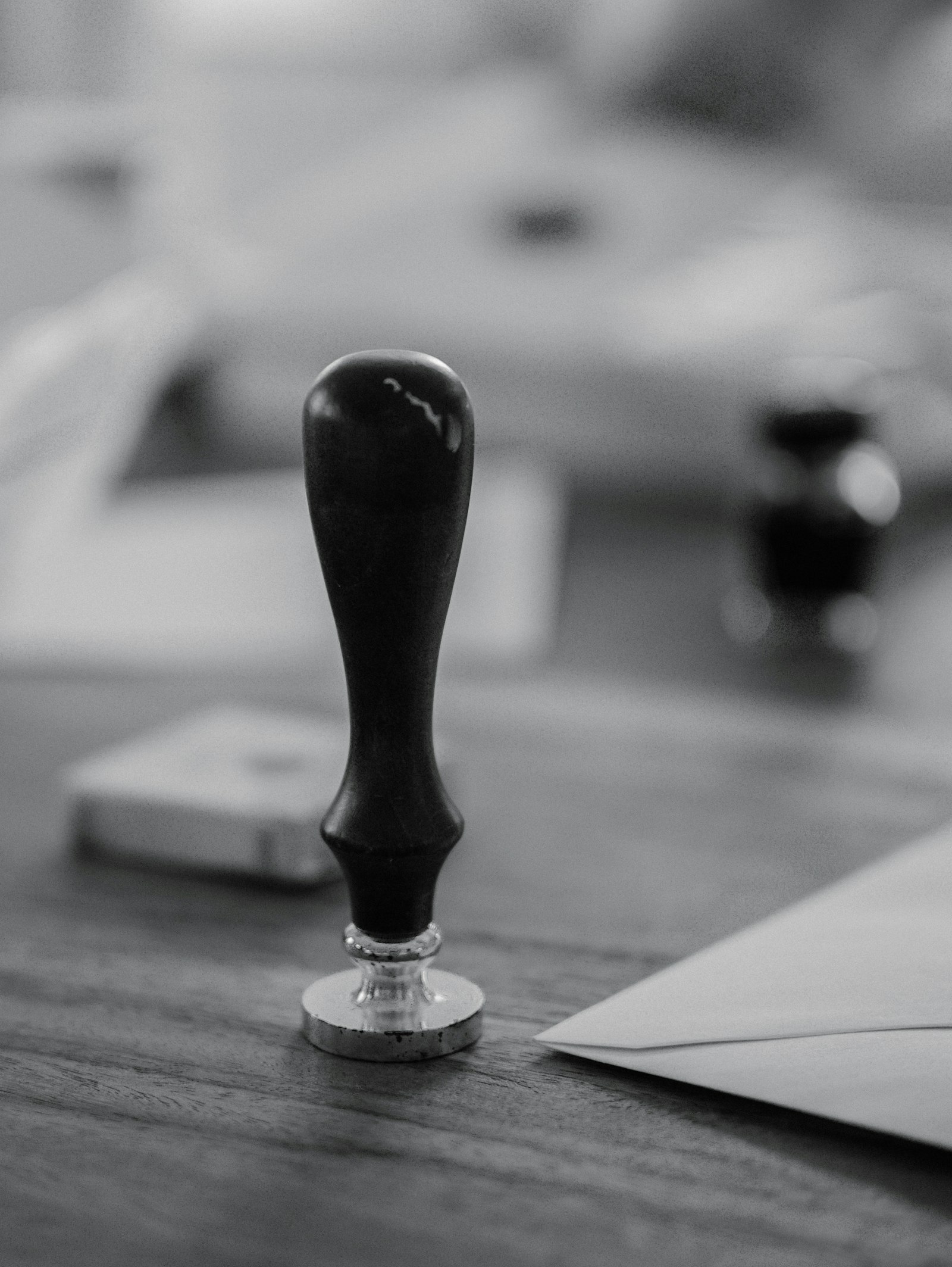 Wooden stamp on a desk representing property trespassing laws in Karnataka