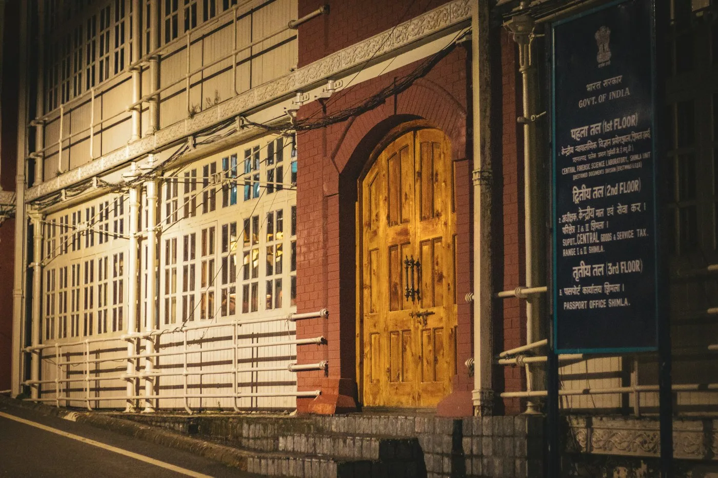 Historic building with a wooden door and an official sign