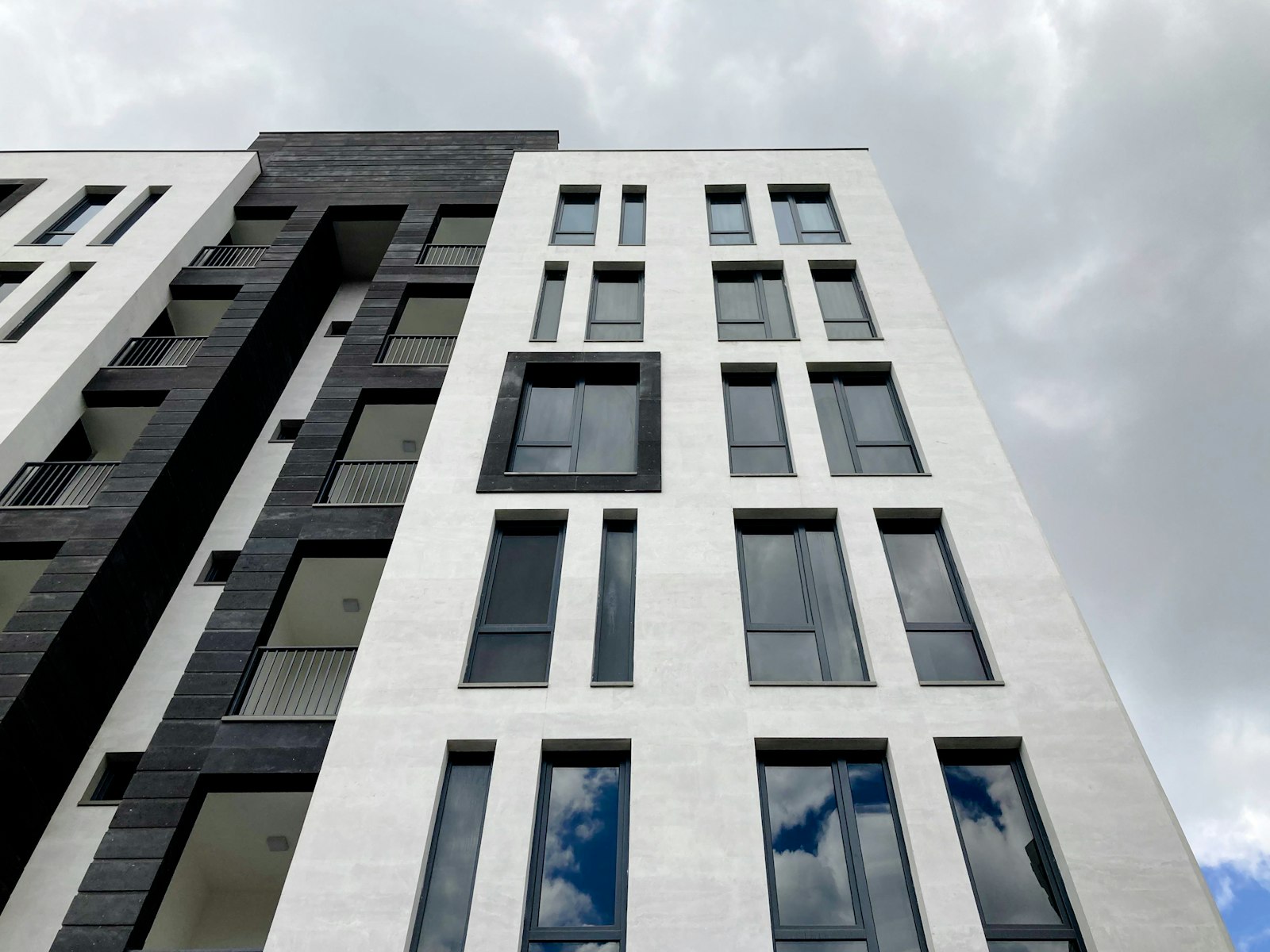Tall building with many windows representing the Whitefield real estate market prices and trends
