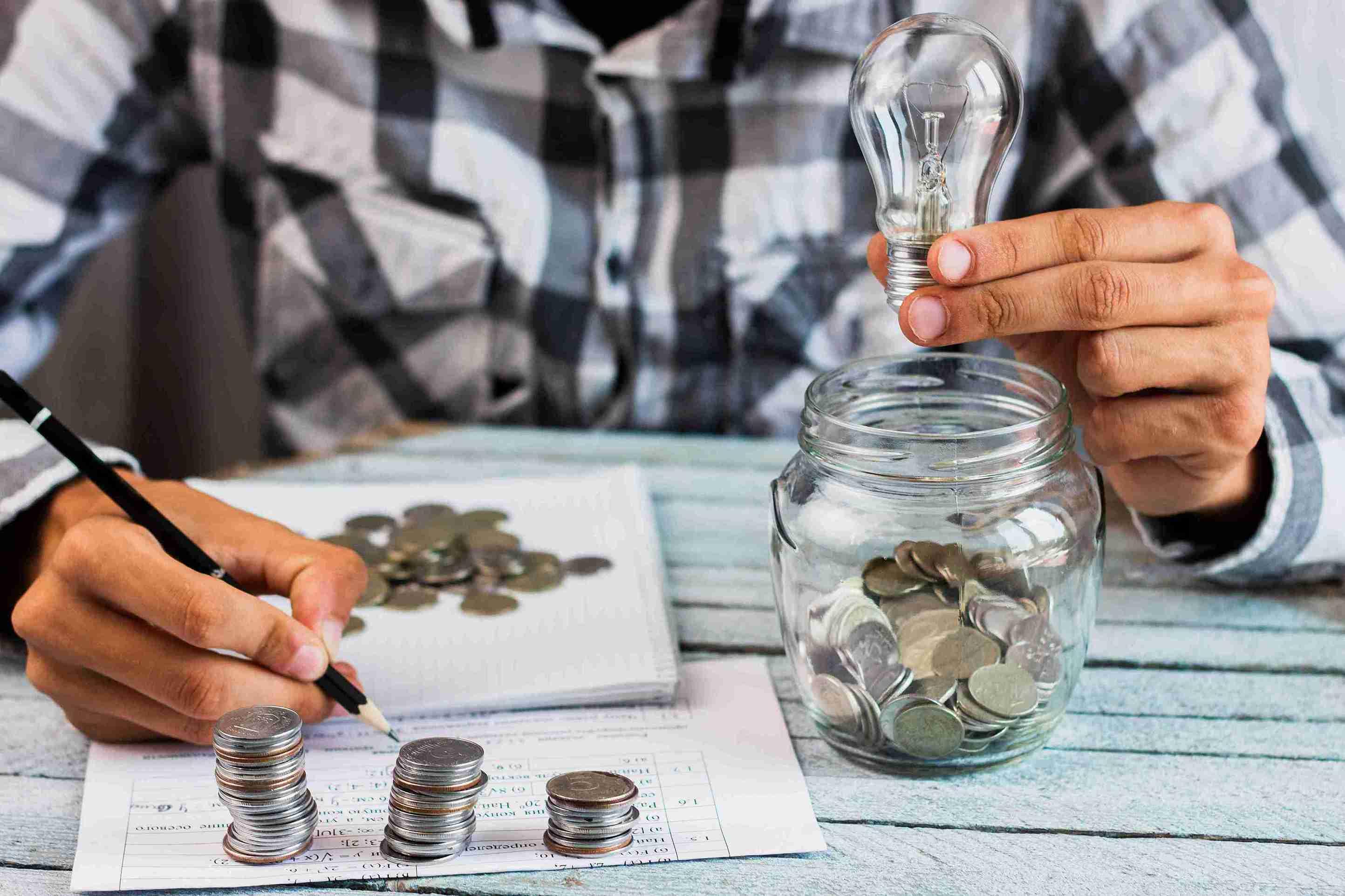 high-angle-man-calculating-savings_11zon