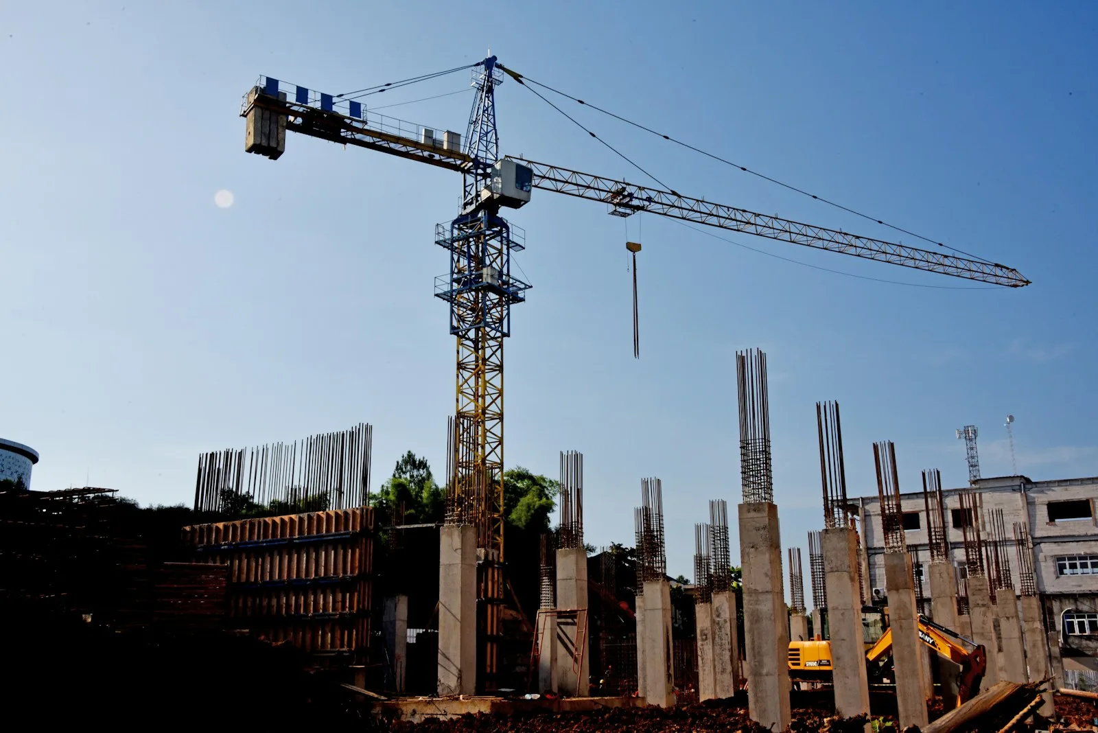 Construction site with a crane and a building going up