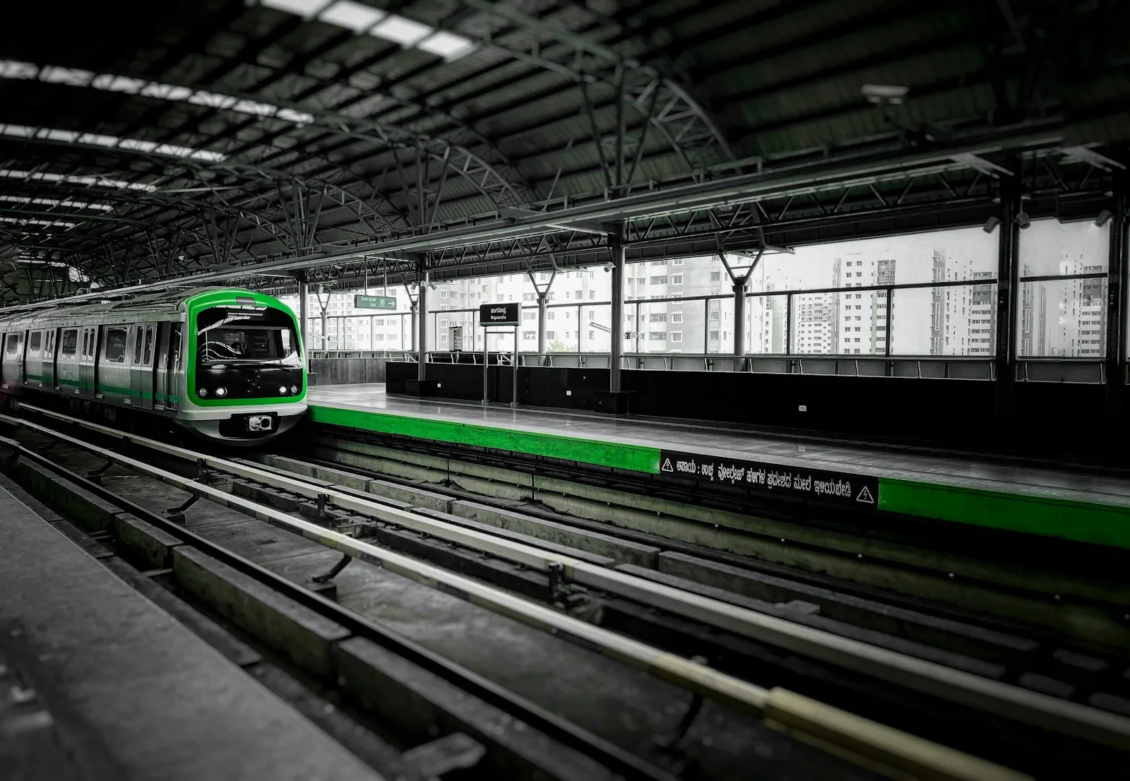 Green and white metro train at a station platform in Bengaluru