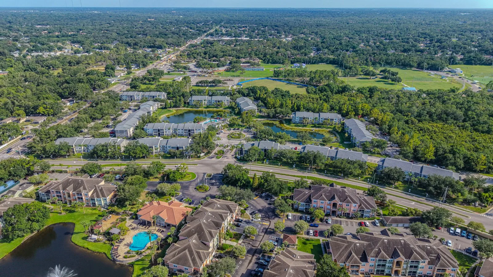 Aerial view of a residential community with trees and ponds used as an illustration