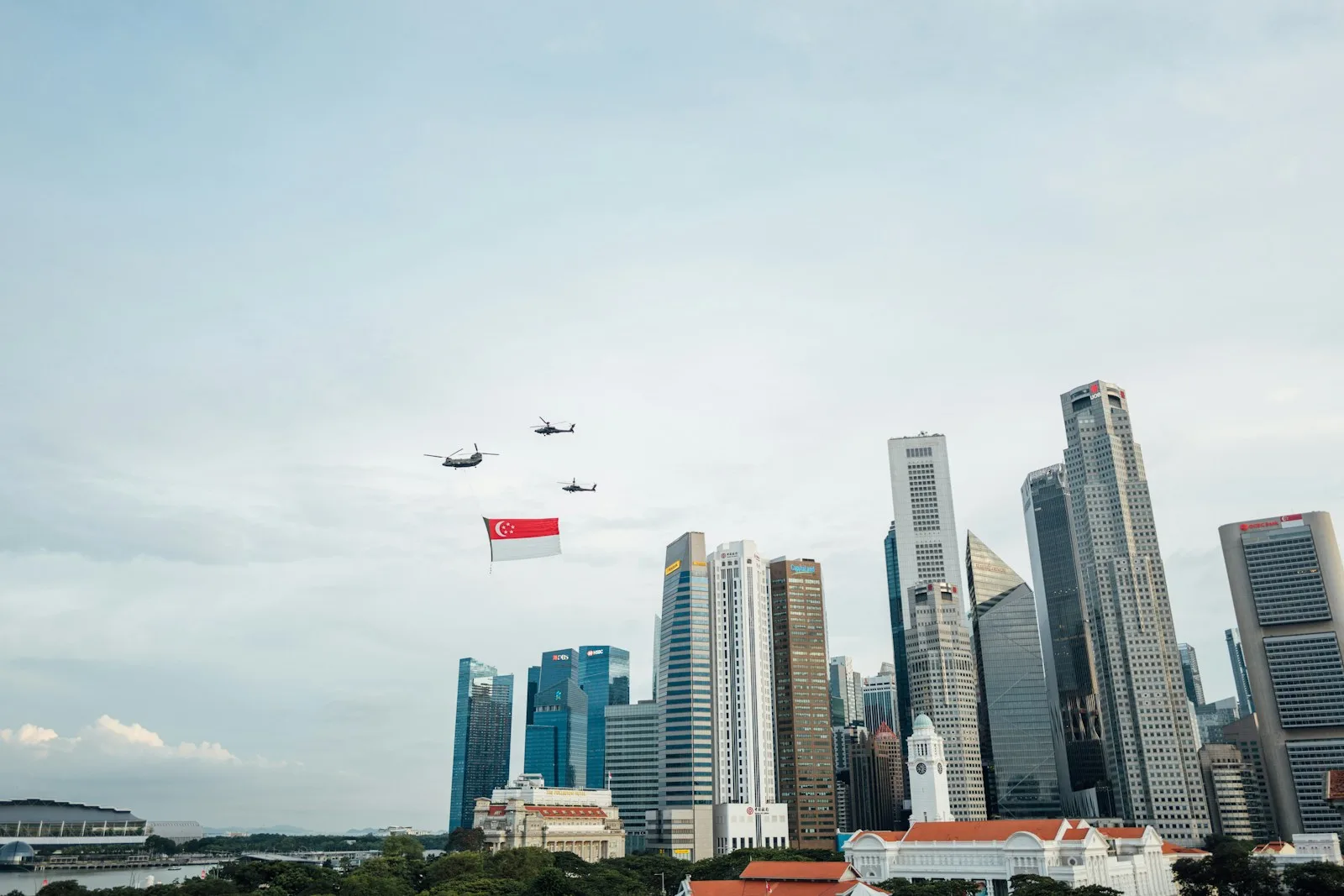 Aeroplane flying over city buildings used as an illustration