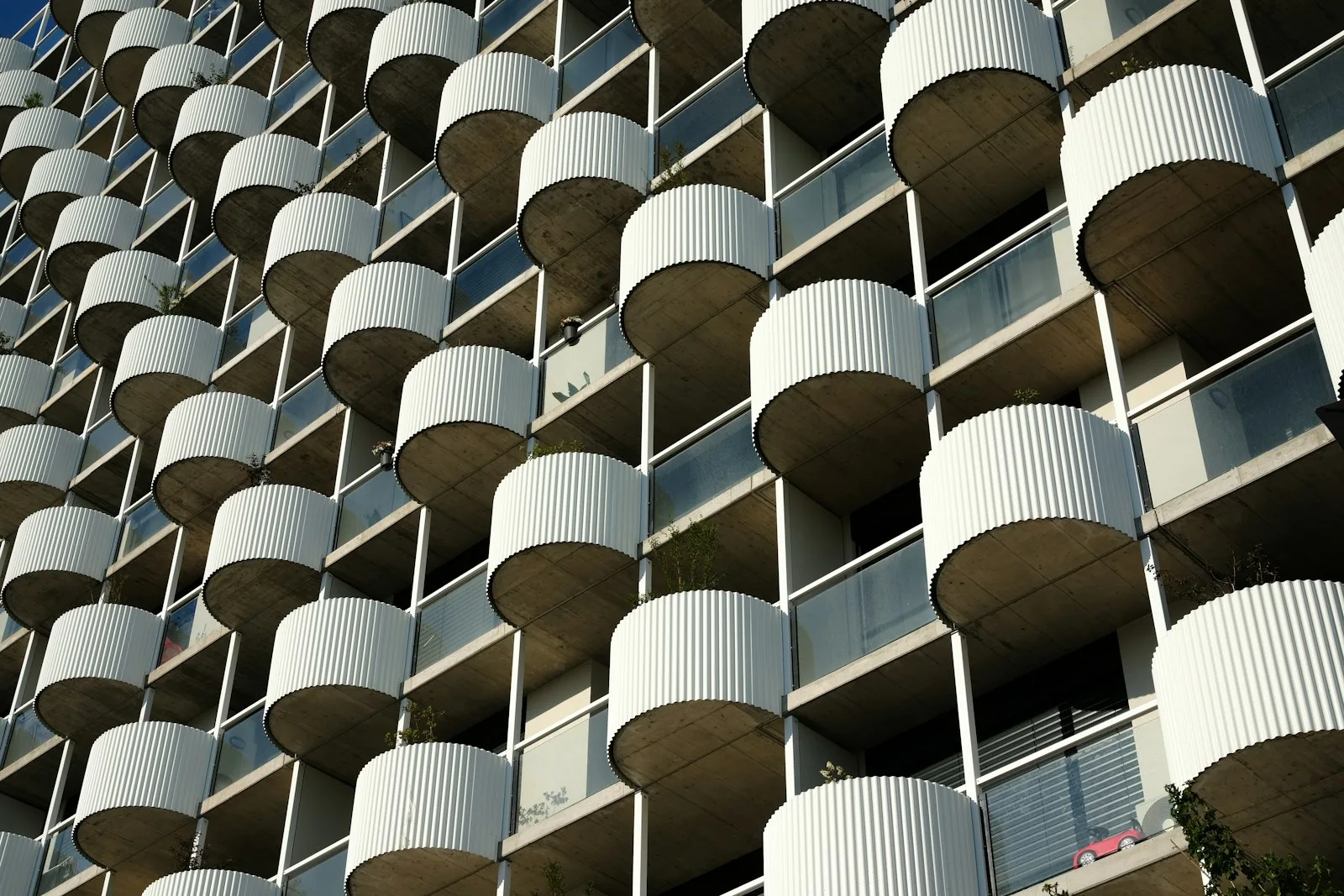 Residential building facade with round ribbed balconies used as an illustration